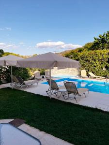 The swimming pool at or close to "Villa Kanavos" apts