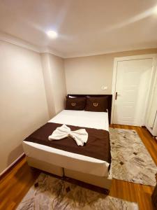 Postel nebo postele na pokoji v ubytování Laleli Palace Hotel