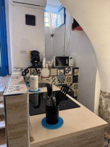 a kitchen with a sink and a counter top at Da Matteo in Gaeta