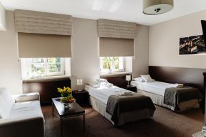 Posteľ alebo postele v izbe v ubytovaní B&B Wieniawa PARKING I ŚNIADANIE W CENIE! BREAKFAST AND PARKING INCLUDED!