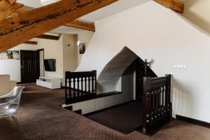 a staircase in a room with a white wall at B&B Wieniawa in Leszno