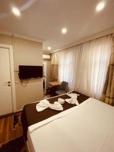 Postel nebo postele na pokoji v ubytování Laleli Palace Hotel