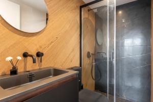 a bathroom with a sink and a shower at Studios Le Médicis in Rouen +78 photos