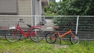 two bikes are parked next to a fence at 海の風 in Wakayama +25 photos