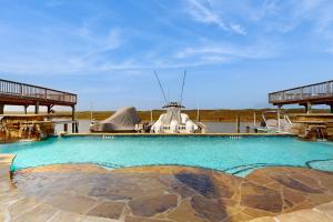 a large swimming pool on a boat in the water at Cottage House #201 in Corpus Christi