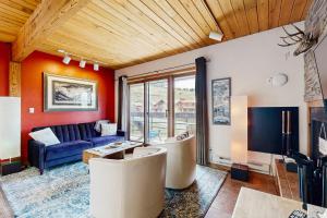 a living room with a couch and a table at Blue Sky Porch in Crested Butte