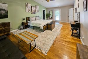 a bedroom with a bed and a living room at Old Cannon Retreat in Hendersonville