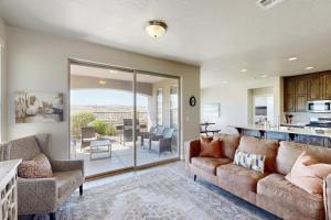 a living room with a couch and a kitchen at The Desert Star Villa in Washington