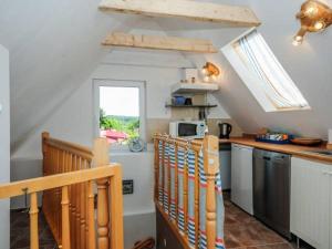 a kitchen with a counter top and a window at Willa Róż Wisełka in Wisełka