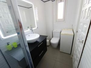 a bathroom with a sink and a toilet at Puerto Rico 6 in Empuriabrava