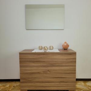 a wooden table with two bowls on top of it at Casa Eliana Mountain Lake Iseo Hospitality in Sovere