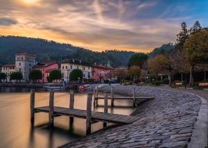 a bench sitting in the water near a river at Casa Lucia in Pella +6 photos