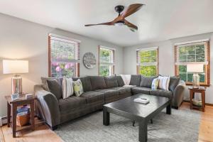 a living room with a couch and a ceiling fan at Perfect Relaxation Spot 5 min to Beach in Eastham