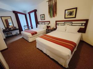 Postel nebo postele na pokoji v ubytování Tierra Viva Machu Picchu Hotel