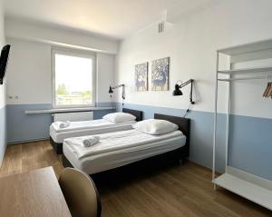 Posteľ alebo postele v izbe v ubytovaní Premium Hostel & Bistro - HostelPremium pl