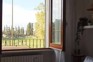 a window with a view of a balcony at Suite Civico 27 in Ugento