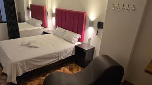 Postel nebo postele na pokoji v ubytování Hostal Prestigio