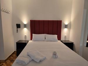 Postel nebo postele na pokoji v ubytování Hostal Prestigio