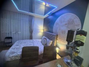 a room with a bed and a camera in front of it at Secret Spa Nis in Niš