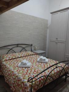 Postel nebo postele na pokoji v ubytování Casetta nel borgo Panta Rhei