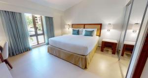 Postel nebo postele na pokoji v ubytování Park Royal Homestay Club Cala Puerto Rico