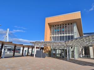 a large building with a brick courtyard in front of it at Tsugaru House1 in Aomori