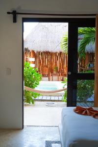 Postel nebo postele na pokoji v ubytování Mis Sueños Holbox
