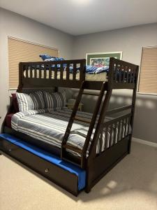 a bedroom with two bunk beds in a room at The Beach House Escape in Bradenton