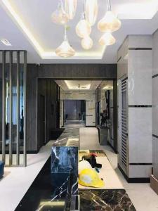 a room with a hallway with a glass floor at Charm Residences Building E in Manila