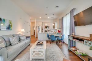 a living room with a couch and a table at Walk to Historic Maryville True Southern Getaway! in Maryville