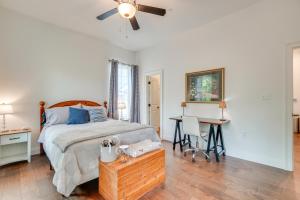 a bedroom with a bed and a table and a desk at Walk to Historic Maryville True Southern Getaway! in Maryville