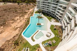 an aerial view of the pool at the apartment building at Luxury Canet in Canet de Berenguer