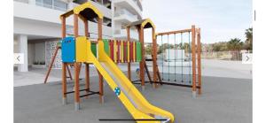 a playground with a slide in a building at Luxury Canet in Canet de Berenguer