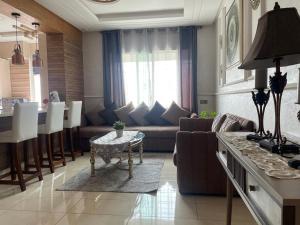 a living room with a couch and a table at home & room center of rabat in Rabat