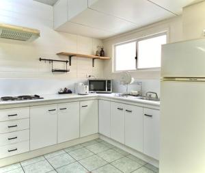 Kuchyň nebo kuchyňský kout v ubytování Hides Hotel
