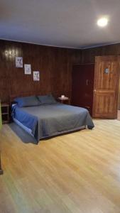 Postel nebo postele na pokoji v ubytování Hostal Fx
