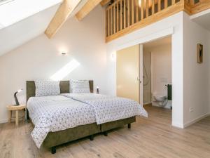 a bedroom with a bed and a bathroom at Lindehoeve in Turnhout +73 photos
