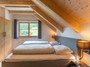Ein Bett oder Betten in einem Zimmer der Unterkunft Haus Ganbei