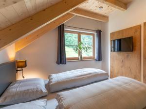 Ein Bett oder Betten in einem Zimmer der Unterkunft Haus Ganbei