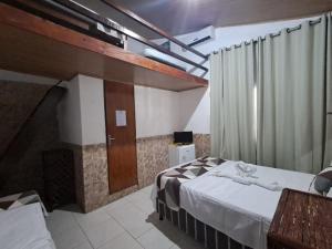 Postel nebo postele na pokoji v ubytování Pousada Vila do Sossego