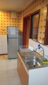 Kuchyň nebo kuchyňský kout v ubytování Hostal Fx