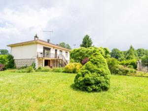 a large bush in front of a house at Holiday Home Maison du Pountet by Interhome in Lacapelle-Biron