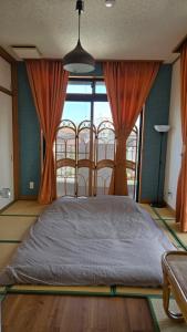 Postel nebo postele na pokoji v ubytování 海の風