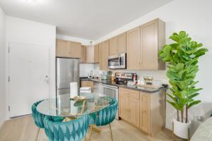 a kitchen with a glass table in a room at Golden Hill Gem 2 Mi to Gaslamp Quarter - Dogs OK! in San Diego
