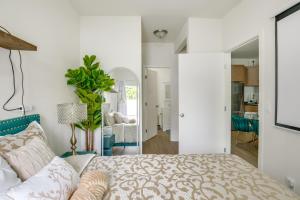 a bedroom with a bed and a living room at Golden Hill Gem 2 Mi to Gaslamp Quarter - Dogs OK! in San Diego