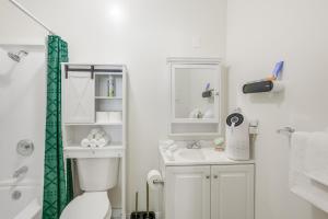 a bathroom with a toilet and a sink at Golden Hill Gem 2 Mi to Gaslamp Quarter - Dogs OK! in San Diego +16 photos