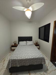 Ένα ή περισσότερα κρεβάτια σε δωμάτιο στο Recanto Trajano