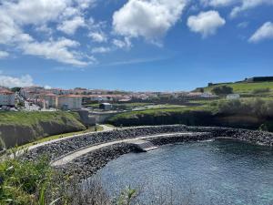 a pool of water with rocks in a river at Casa da Arquitectura - Texturas in Angra do Heroísmo