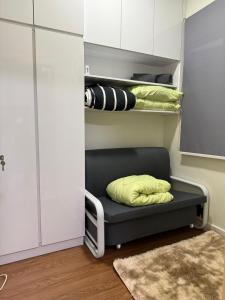 a room with a bed with a pillow on it at Rose & Ross Homestay Taman Mutiara Rini in Skudai