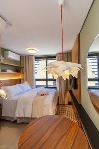 Postel nebo postele na pokoji v ubytování Studio Moderno e Aconchegante no All Batel-BAT0721